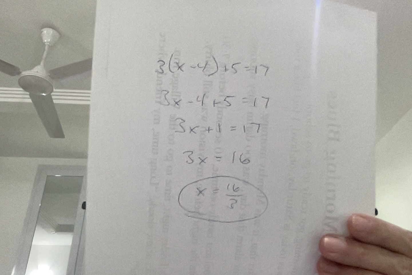 Handwritten student work showing steps to solve 3(x-4)+5=17